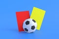 Soccer ball near red, yellow cards on blue background