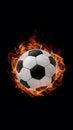 Soccer ball portrayed on fire against black background