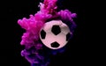 Soccer ball on a purple-pink background. Concept of advertising football competition