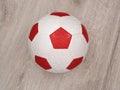 Soccer Ball in red and white colors Royalty Free Stock Photo