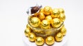 Soccer Ball-shaped chocolates in gold foil on a white background Royalty Free Stock Photo