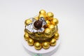 Soccer Ball-shaped chocolates in gold foil on a white background Royalty Free Stock Photo