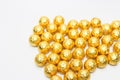 Soccer Ball-shaped chocolates in gold foil on a white background Royalty Free Stock Photo
