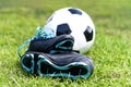 soccer ball and shoes in grass