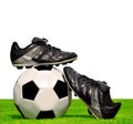 Soccer ball and shoes in grass