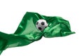 Soccer ball and Smooth elegant transparent green cloth isolated or separated on white studio background. Royalty Free Stock Photo