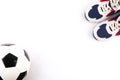 soccer ball, and sport footwear on white background flat lay Royalty Free Stock Photo