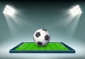Soccer ball and stadium field on smartphone screen Royalty Free Stock Photo