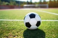 Soccer ball waits on the field, ready for the beautiful game