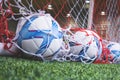 Soccer balls in soccer goal on soccer training field