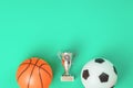 Soccer and basketball concept with balls and cup Royalty Free Stock Photo