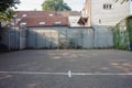 Soccer cage in the city, iron gate protection grid with soccer court behind it, empty