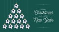 Soccer Christmas and new year greeting card bauble tree. Creative Xmas tree made by football ball on black background for