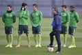 Soccer coach and players during training session