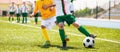 Soccer competition between two young boys. Kids football teams playing tournament match