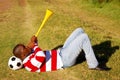 Soccer fan blowing Vuvuzela Royalty Free Stock Photo