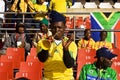 Soccer Fan Blows on Vuvuzela Horn Royalty Free Stock Photo