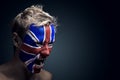 Soccer fan painted flag on his face Royalty Free Stock Photo