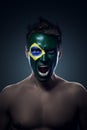 Soccer fan painted flag on his face Royalty Free Stock Photo