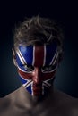 Soccer fan painted flag on his face Royalty Free Stock Photo