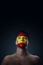 Soccer fan painted flag on his face Royalty Free Stock Photo