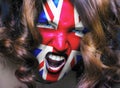 Soccer fan with United Kingdom flag painted over face Royalty Free Stock Photo