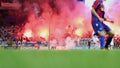 Soccer fans cheering at the stadium