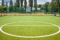 Soccer field with artificial green grass near the school. Amateur football field. Sunny summer day Royalty Free Stock Photo