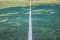 Soccer field with artificial green grass near the school. Amateur football field. Sunny summer day Royalty Free Stock Photo