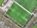 Soccer field form above, people playing sports, leisure and fitness health activities. Green pitch playing field. Aerial Royalty Free Stock Photo