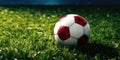 Soccer Field with Vibrant Green Grass and Football Ball. Front View of Lawn with White and Red Soccer Ball. Generative Royalty Free Stock Photo