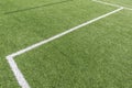Soccer football background. Green synthetic artificial grass soccer sports field with white stripe lines Royalty Free Stock Photo