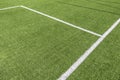 Soccer football background. Green synthetic artificial grass soccer sports field with white stripe lines Royalty Free Stock Photo