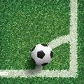 Soccer football ball in corner area of soccer field with green grass. Royalty Free Stock Photo