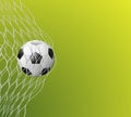 Soccer or football ball in goal net on green background, sport accessory, equipment for playing game Royalty Free Stock Photo