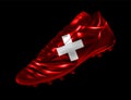 Soccer football boot with the flag of Switzerland printed on it Royalty Free Stock Photo