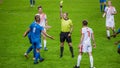 Soccer Football Championship Match: Referee Sees Foul, Gives Signal and Yellow Card, Players Circle Royalty Free Stock Photo