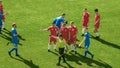 Soccer Football Championship Match: Referee Sees Foul, Gives Signal and Yellow Card, Players Circle Royalty Free Stock Photo