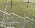 Soccer or football corner lines through safety net Royalty Free Stock Photo