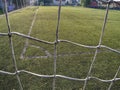 Soccer or football corner lines through safety net Royalty Free Stock Photo