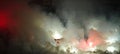 Soccer or football fans using pyrotechnics