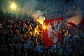 Soccer or football fans using pyrotechnics