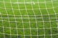 Soccer football field close up. Sports net at the football goal. Doing sports on the playground and healthy lifestyle concept Royalty Free Stock Photo