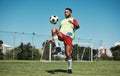 Soccer, football game and black man player on a sports field with a match ball. Fitness, training exercise and health Royalty Free Stock Photo