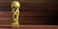 Soccer football golden trophy on wooden background. 3d illustration