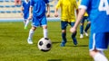 Soccer Football Match. Kids Playing Soccer. Young Boys Kicking Football Ball on the Sports Field Royalty Free Stock Photo