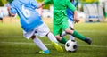 Soccer Football Match. Young Boys Kicking Football Ball on the Sports Pitch Royalty Free Stock Photo