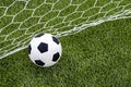 The soccer football with the net on the artificial green grass soccer field Royalty Free Stock Photo