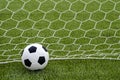 The soccer football with the net on the artificial green grass soccer field Royalty Free Stock Photo