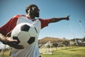 Soccer, football player and black man on a sports field with ball for game or match. Fitness, happy captain male and